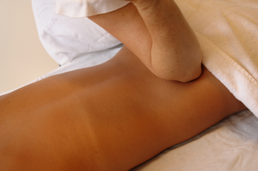woman receiving deep tissue massage