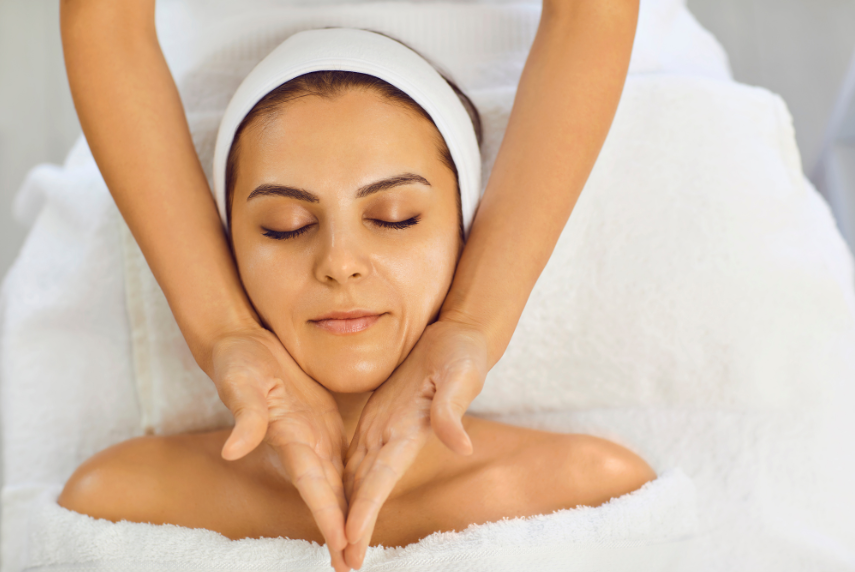 woman receiving facial massage